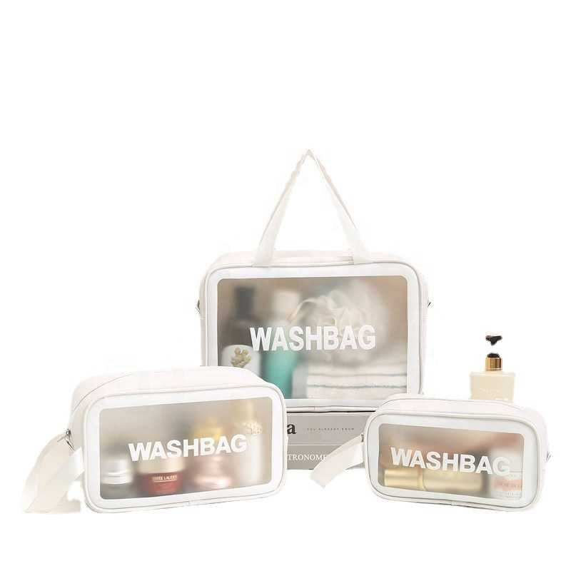 Set of three white washbags with 'WASHBAG' text on a white background